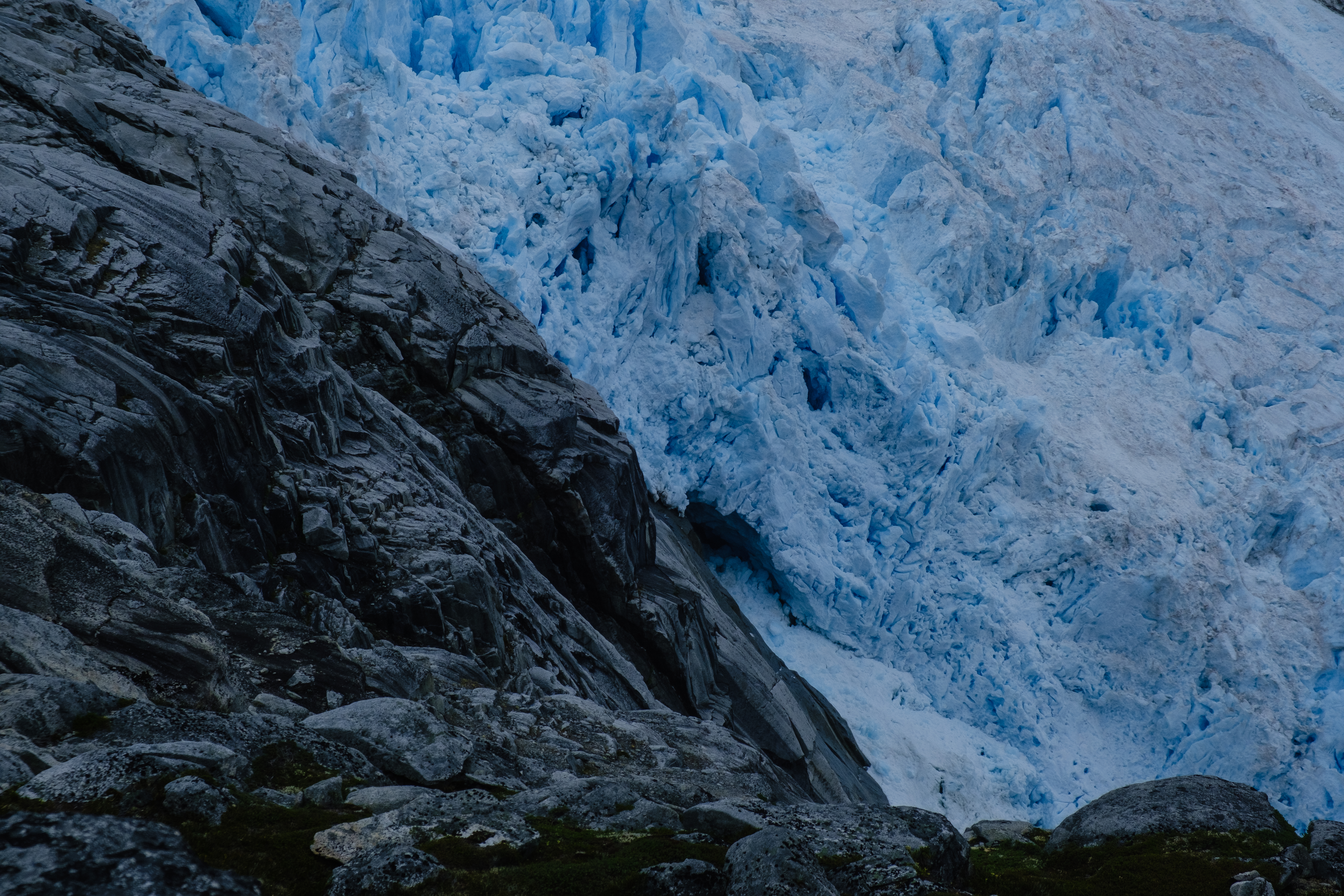 Dramatic pic of the icefield. Black stones give a strong constrast to the blue ice. An icefall is noisy, you will hear iceblocks, huge as houses, crash and tumble down every now and then.